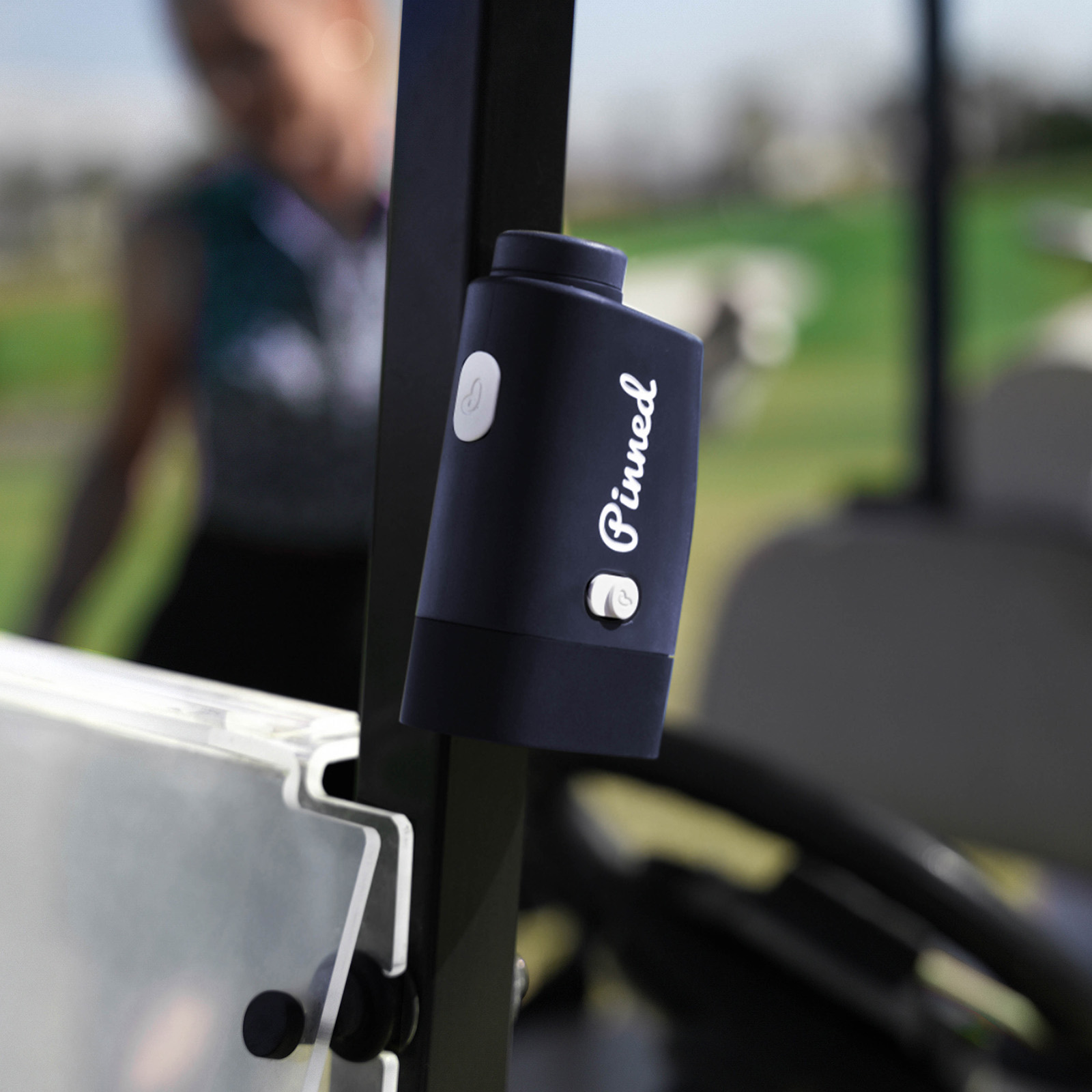 Pinned Golf Prism+ Rangefinder designed to attached magnetically to golf cart 